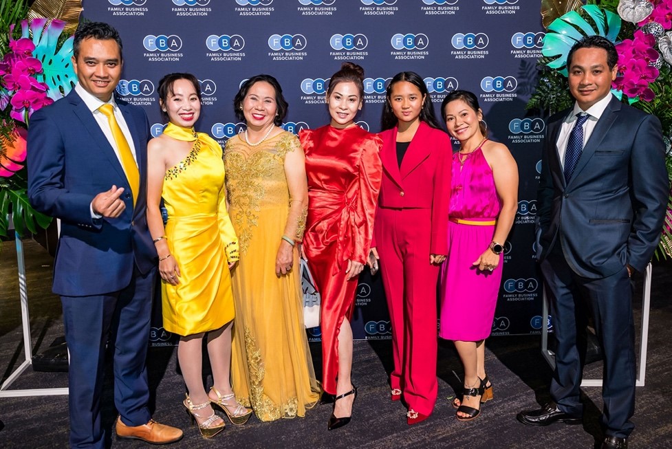 A group of people posing for a photoDescription automatically generated